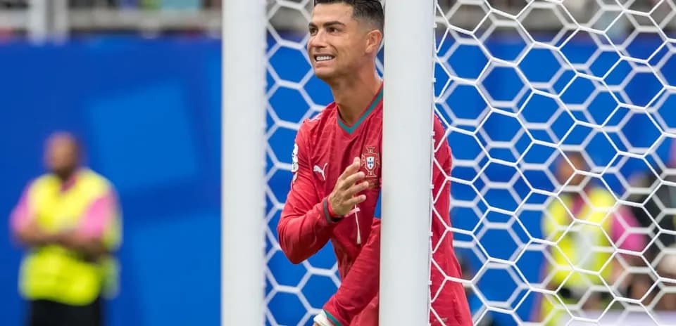 Cristiano Ronaldo celebrating near the goal post