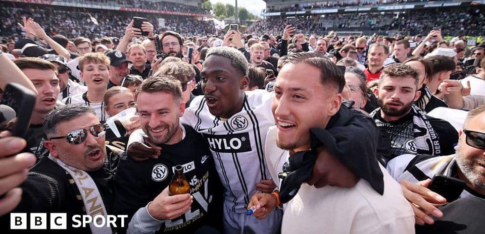 Celebration among fans and players at stadium