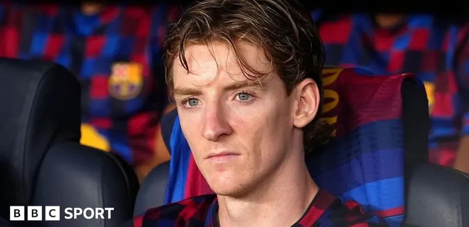 Jugador sentado en el banquillo de FC Barcelona