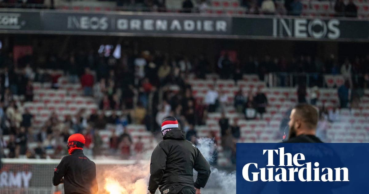 Aflare being lit by fans in stadium stands