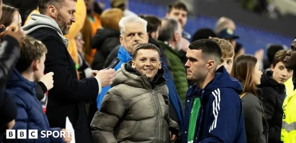 A group of fans interacting at a sports event