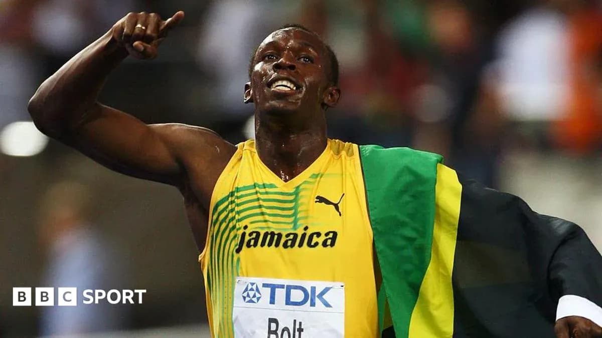 Atleta celebrando con bandera de Jamaica tras carrera