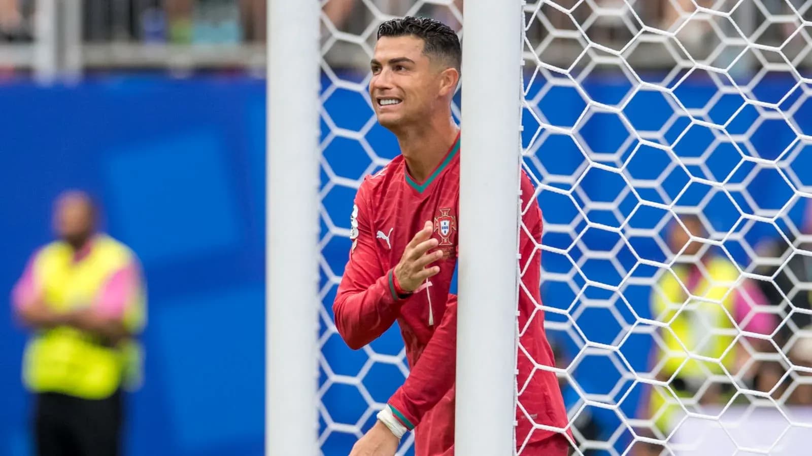 Cristiano Ronaldo celebrating near the goal post Cristiano Ronaldo celebrating near the goal post
