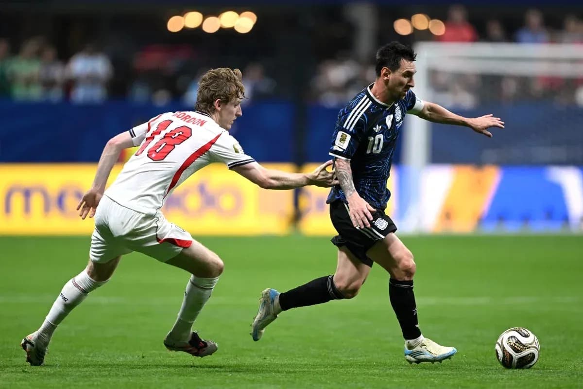 Lionel Messi dribbling past defender during match Lionel Messi dribbling past defender during match