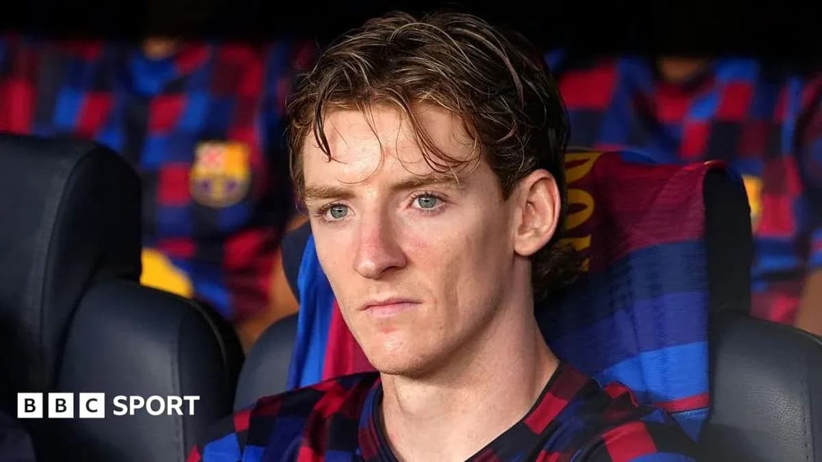 Jugador sentado en el banquillo de FC Barcelona Jugador sentado en el banquillo de FC Barcelona